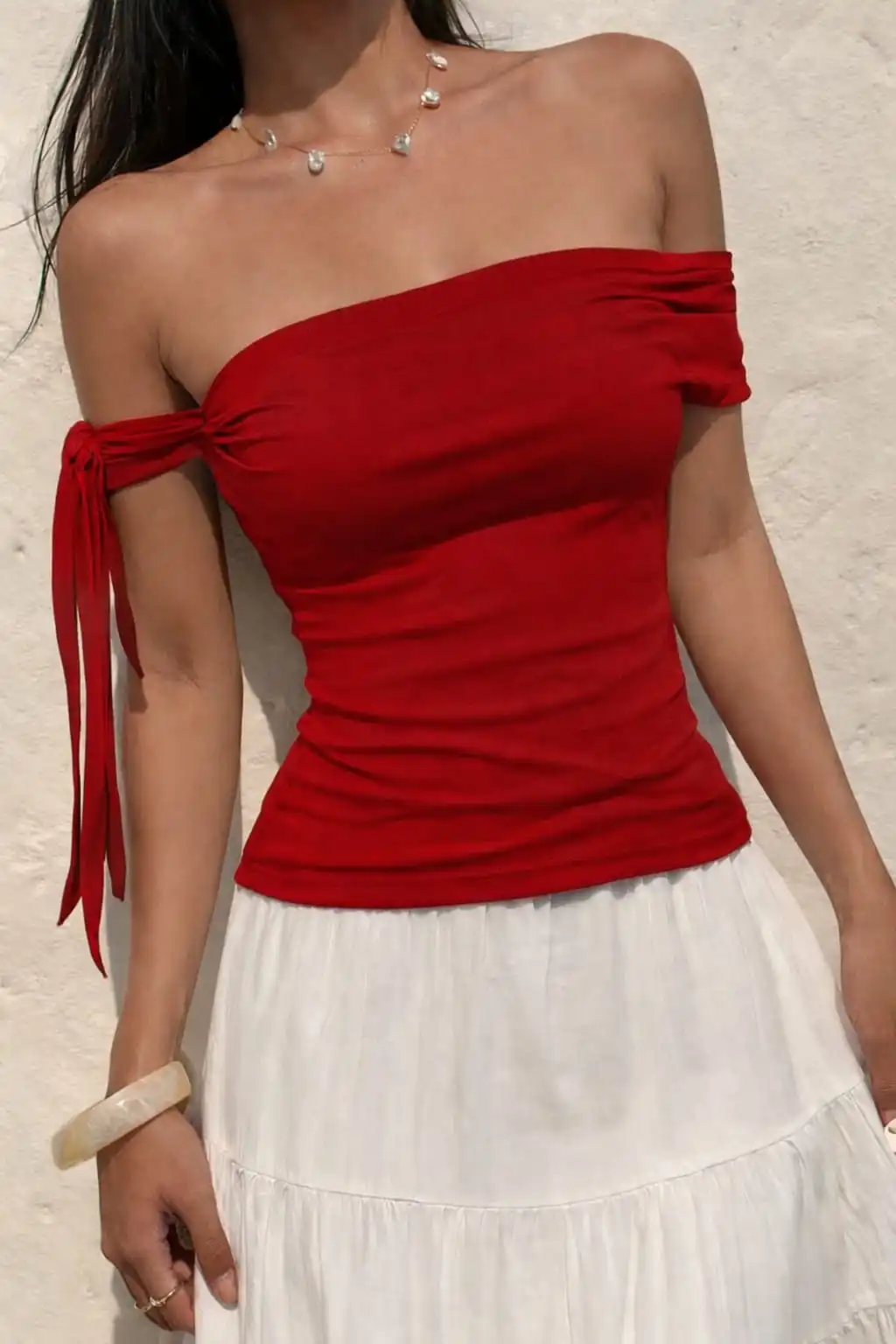 Red off shoulder tops for women styled with white skirt for elegant date night outfit