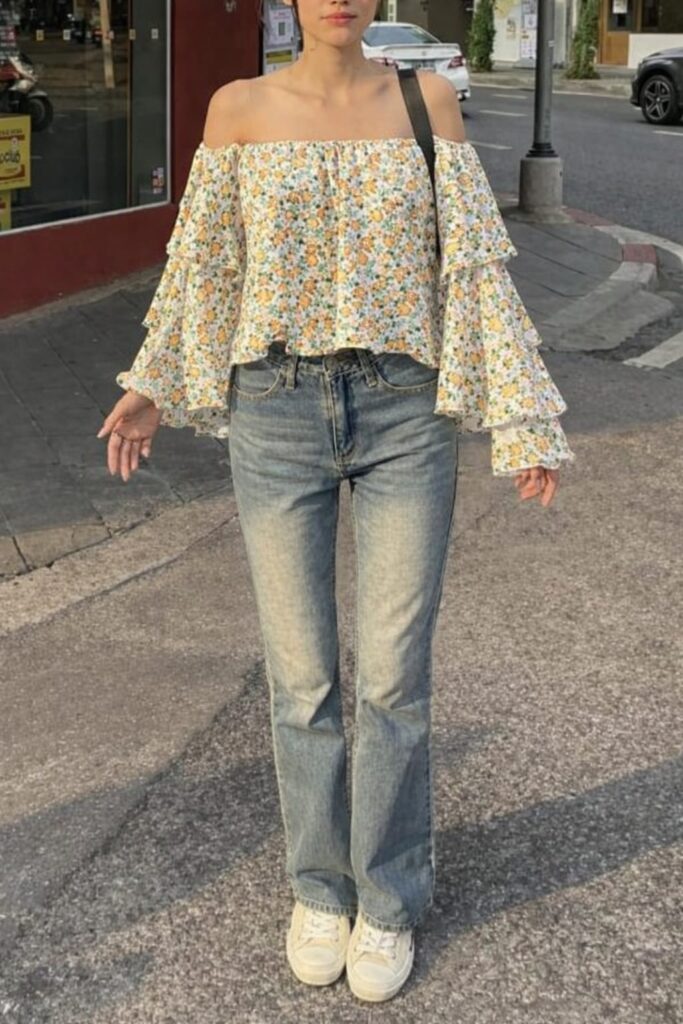 Floral off shoulder tops for women with ruffle sleeves styled with wide leg jeans for a soft romantic look