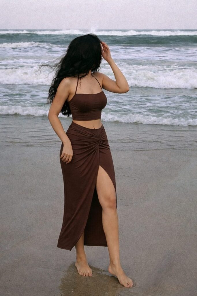 Brown two piece set featuring a tube top and high waist slit skirt, styled for a flattering and chic summer evening look.