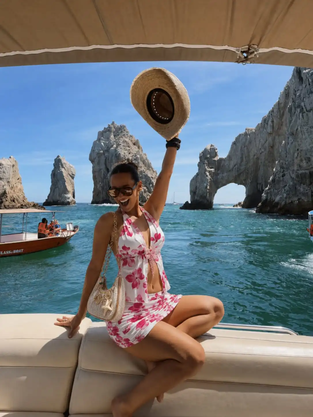 Woman wearing a pink floral halter top and ruched mini skirt set with a woven starfish shoulder bag for a beach vacation outfit.
